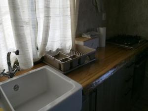 a kitchen counter with a sink and a window at Holiday Home Anka in Gospić +32 photos
