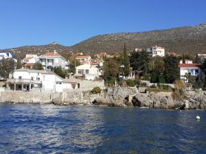 a view of a town from the water with houses at Apartments Rudi - One Bedroom Apartmen with Terrace and Sea View in Klenovica