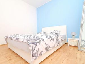 a bedroom with a bed and a mirror at Apartment Marjana Prizba with terrace in Prizba