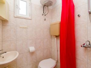 a bathroom with a toilet and a sink at Apartments Ra ica Molunat - Basic Studio in Molunat