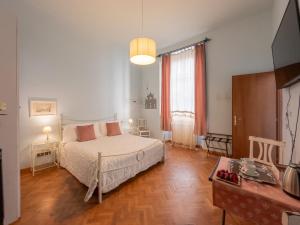 A bed or beds in a room at Affittacamere Firenze in Libertà Parterre
