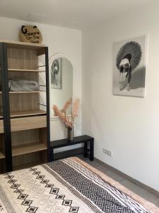 a bedroom with a bed and a mirror at La Détente in Bonifacio