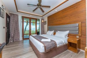 Postel nebo postele na pokoji v ubytování Pearl Sands of Maldives