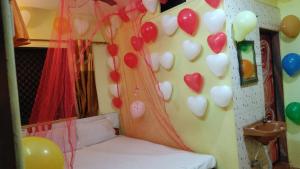 a room with a bunch of hearts on the wall at Bluestar cottage in Matheran
