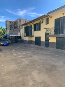 a car parked in a parking lot next to a building at Holiday Home in San Giorgio a Cremano +6 photos