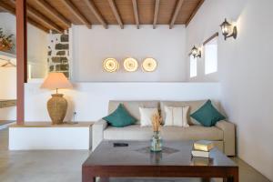 a living room with a couch and a table at Finca de La Geria in Yaiza