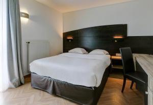 Postel nebo postele na pokoji v ubytování B&B HOTEL Montbéliard-Sochaux + 37 fotografií