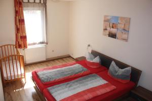 a bedroom with two beds and a window at Schwalbe in Saal