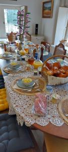 a long table with plates of food on it at La Cadole de Chardonnay in Chardonnay
