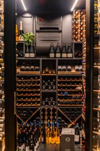 a wine cellar with lots of bottles of wine at Villa Bryggekanten - by Classic Norway Hotels in Henningsvær