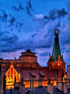 a building with a ferris wheel on top of it at Apartment with Entresol Old Town Krakow in Krakow