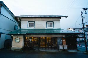 a building with a store in front of it at Hostel&Bar CAMOSIBA in Yokote +63 photos