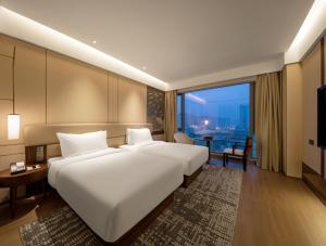 Postel nebo postele na pokoji v ubytování Maison New Century Hotel Cixi Hangzhou Bay + 37 fotografií