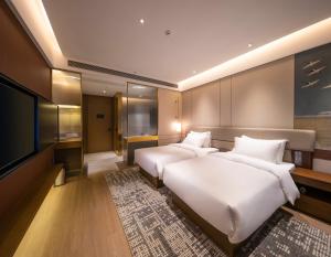 Postel nebo postele na pokoji v ubytování Maison New Century Hotel Cixi Hangzhou Bay