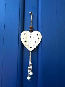 a white heart with stars on a blue door at Casa Rural La Santa in Sorribas +53 photos
