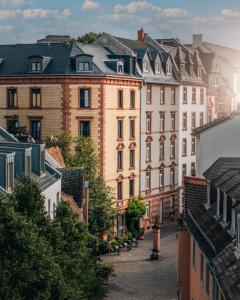 a street in a city with tall buildings at Libertine Lindenberg in Frankfurt/Main