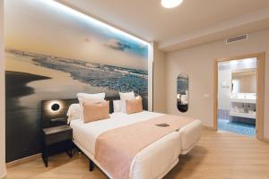 Postel nebo postele na pokoji v ubytování Palau Suites & Apartments