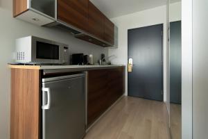 Kuchyň nebo kuchyňský kout v ubytování Máni Apartments