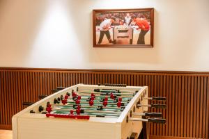 a large foosball game on display in a room at Sunny Beach Resort & Spa Mui Ne in Mui Ne