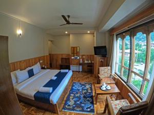 TV a/nebo společenská místnost v ubytování Khamsum Inn