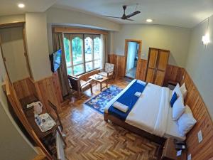 Postel nebo postele na pokoji v ubytování Khamsum Inn