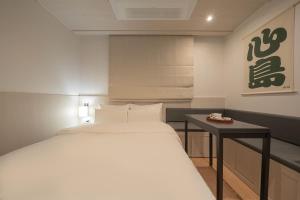 Simdo Hotel&Spa Sillim by Aank客房内的一张或多张床位