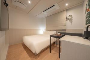 Simdo Hotel&Spa Sillim by Aank客房内的一张或多张床位