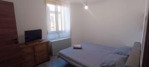 Postel nebo postele na pokoji v ubytování a casa di ASIA