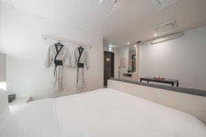 Simdo Hotel&Spa Sillim by Aank客房内的一张或多张床位