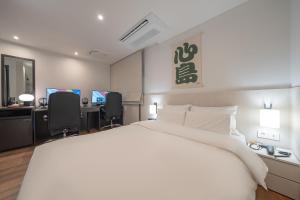 Postel nebo postele na pokoji v ubytování Simdo Hotel&Spa Sillim by Aank + 37 fotografií