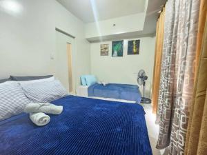 Ένα ή περισσότερα κρεβάτια σε δωμάτιο στο Greenview Getaway in Baguio
