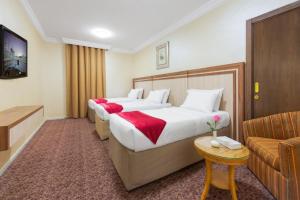 Postel nebo postele na pokoji v ubytování Palestine Hotel Makkah