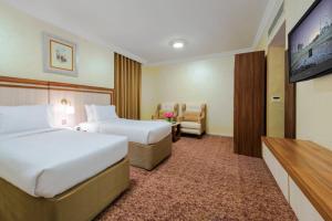 Postel nebo postele na pokoji v ubytování Palestine Hotel Makkah