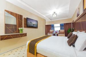 Postel nebo postele na pokoji v ubytování Palestine Hotel Makkah
