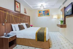 Postel nebo postele na pokoji v ubytování Palestine Hotel Makkah