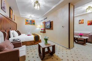 Postel nebo postele na pokoji v ubytování Palestine Hotel Makkah