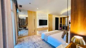 TV a/nebo společenská místnost v ubytování Grandia Hotel