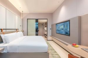 ONESS Executive Hotel Guangzhou Huangpu-Free Shuttle Bus from 15th October to 5th November客房内的一张或多张床位