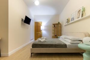 Postel nebo postele na pokoji v ubytování Aureum Angelicum