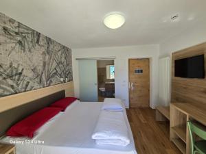 Postel nebo postele na pokoji v ubytování Hotel Miramonti