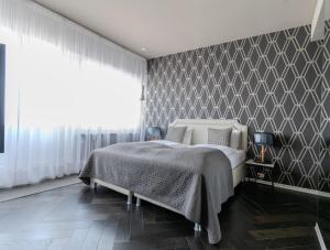 Postel nebo postele na pokoji v ubytování Máni Apartments