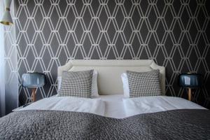 Postel nebo postele na pokoji v ubytování Máni Apartments