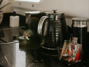 a coffee maker sitting on top of a counter at Waterfront Houseboat in Cape Town