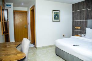 Havilah Towers Hotel Ltd客房内的一张或多张床位