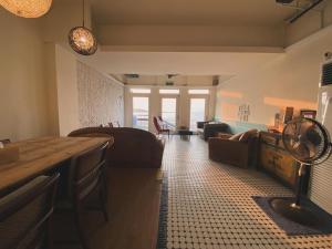 a living room with a couch and a table at Chill Chill House in Shimen District