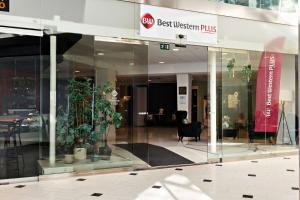a glass entrance to a best western plus building at Best Western Plus Park City Solna in Solna