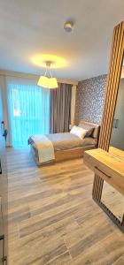 Ένα ή περισσότερα κρεβάτια σε δωμάτιο στο Hira Boarding Aparthotel