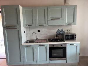 Η κουζίνα ή μικρή κουζίνα στο Orchidea del Garda Rooms & Apartments