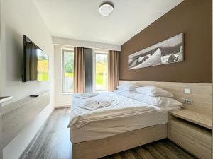 Postel nebo postele na pokoji v ubytování Apartmán Pec + 37 fotografií