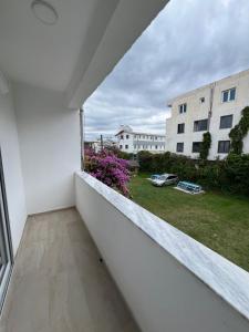 a balcony with a view of a building at NEAR Guest-house in Durrës